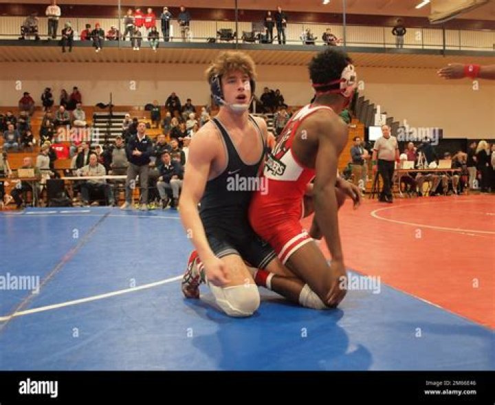 Can high school wrestlers have facial hair?